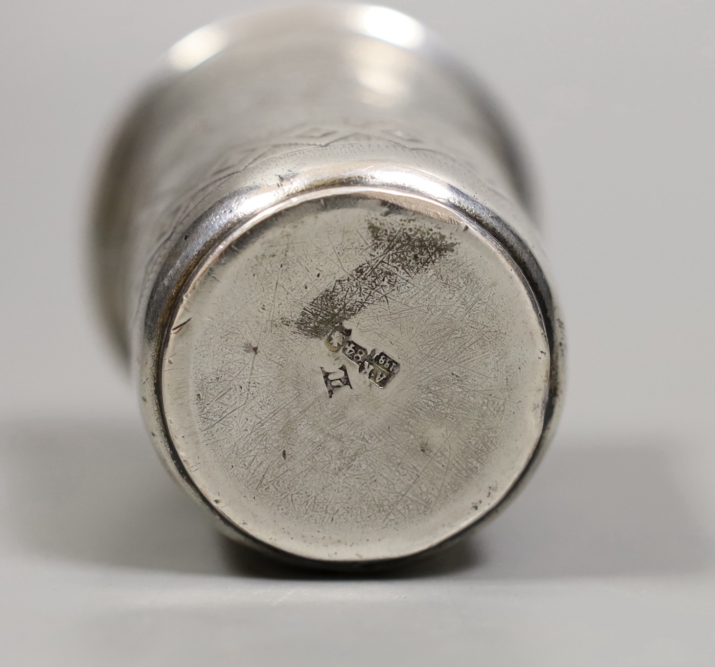 A 19th century Russian 84 zolotnik tumbler, with engraved decoration, marks rubbed, 7.5cm